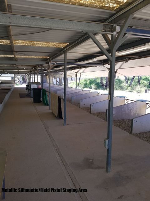 Covered staging area with benches behind the firing line
