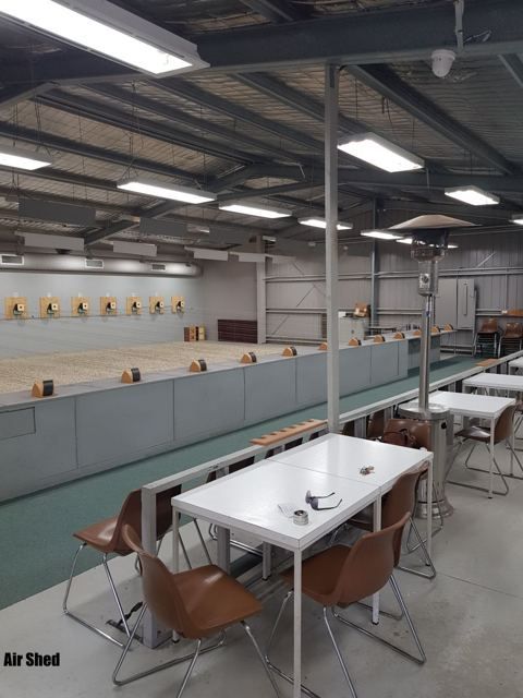 Tables and chairs behind the firing line in the Air Shed