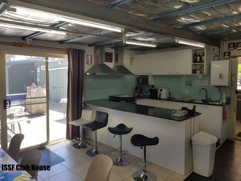 Kitchen and bar stools inside the ISSF club house